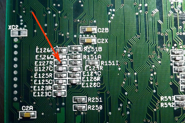 Bottom side of Amiga 1200 mainboard near Alice chip. Element E127R marked with red arrow.